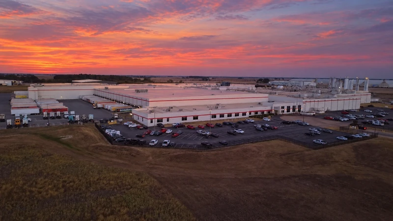 Aerial view of the Frito-Lay facility beneath a coral sunset sky